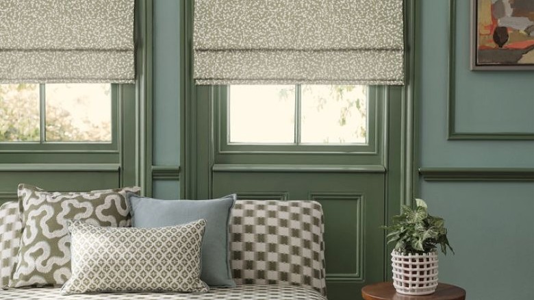 Green printed Roman shades that match green casings