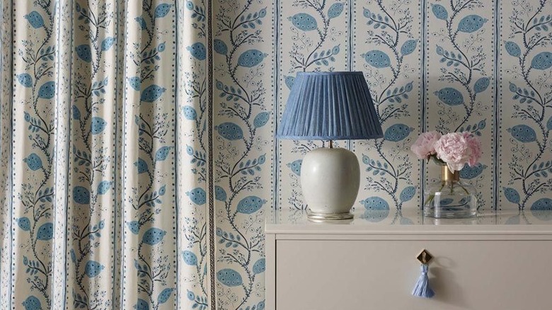 Blue floral wallpaper with matching curtains