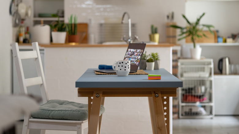 laptop on desk in kitchen