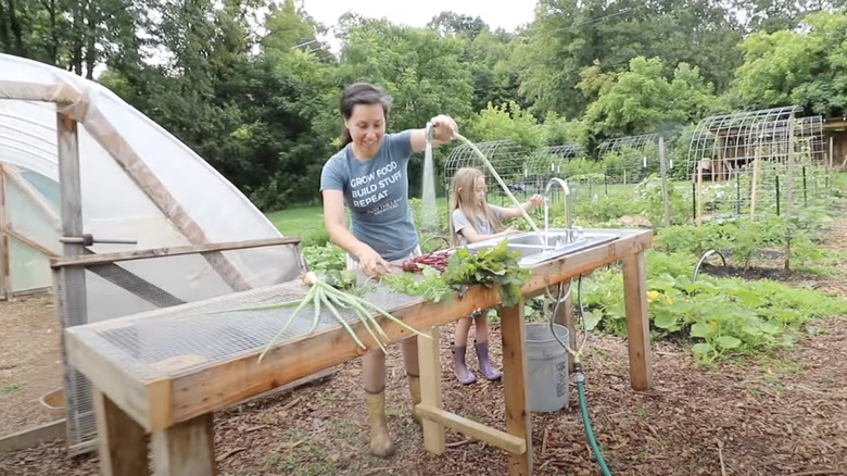 mom and daughter using outdoor sink