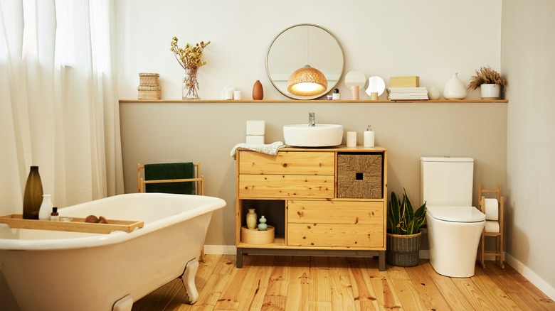Open shelf above toilet and sink with decor items displayed