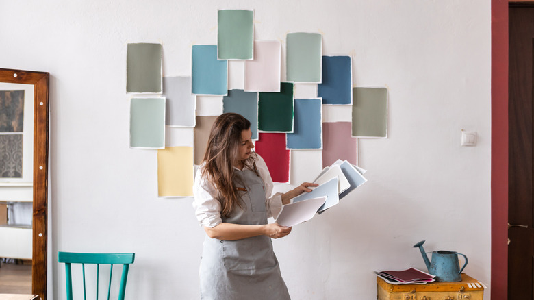 Someone trying to choose a wall color