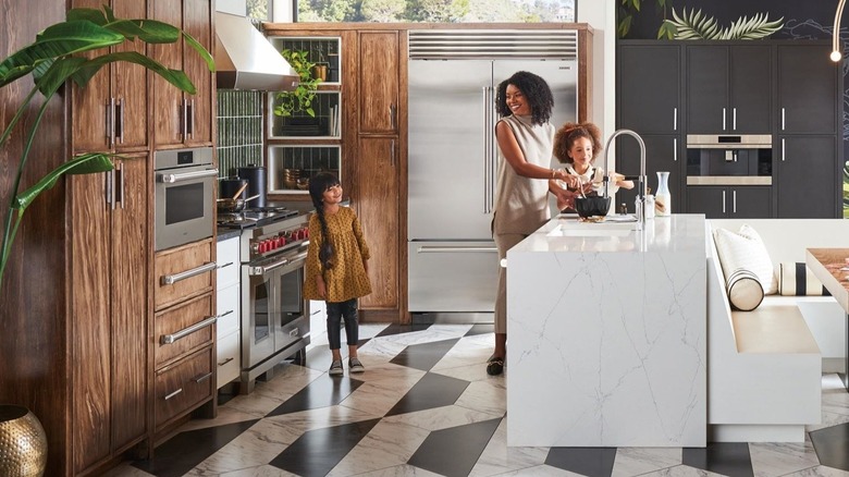 Family in a kitchen with Wolf ranges