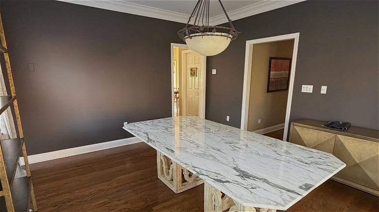A room with a white marble table and walls painted with Silhouette by Benjamin Moore