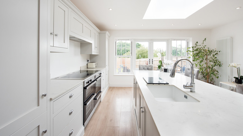 Bright white modern kitchen interior.