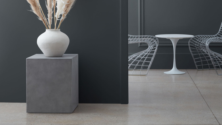 A charcoal black space with contemporary furniture.