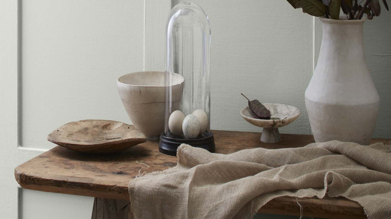 Gray wall with natural table display.