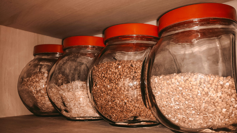 stock of brown buckwheat and oatmeal on a shelf.