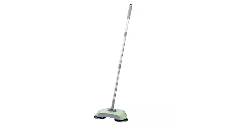 A spin sweeper with a green body and silver-and-gray handle