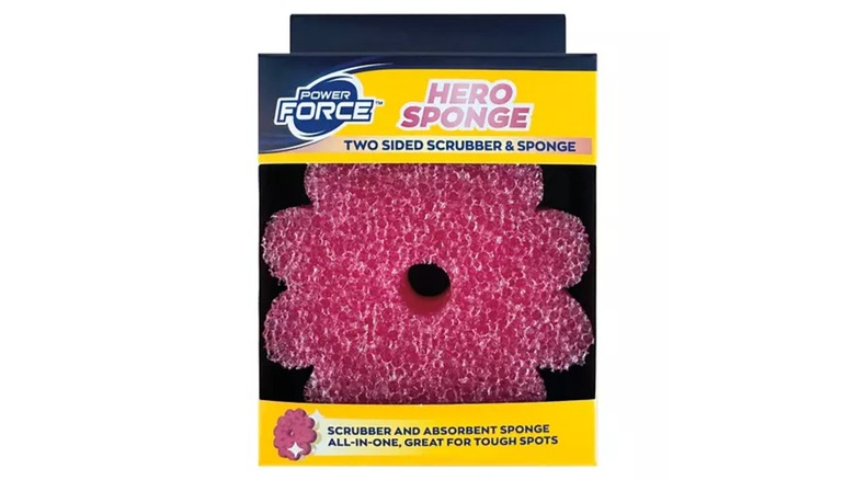 A box containing a pink, textured, flower-shaped Hero Sponge