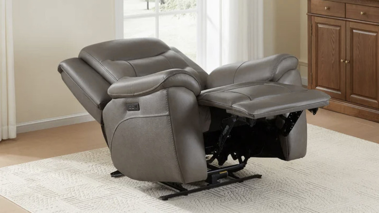Mason recliner in the reclined position on a rug in a living room