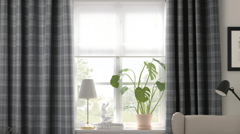 The HÄGGVECKMAL Room darkening curtains from IKEA hanging in a living room window