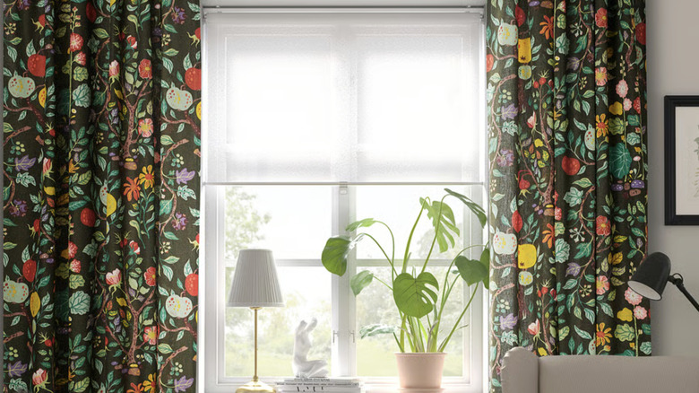 The VILDPERSILJA curtains from IKEA hanging in a living room