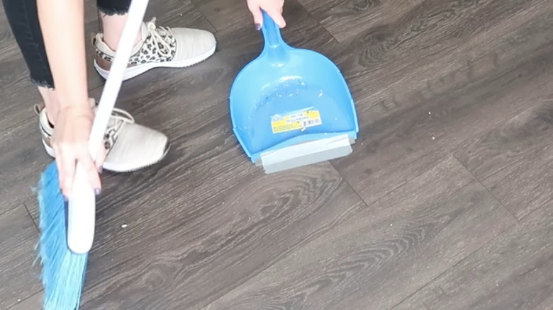 dust pan duct taped to floor