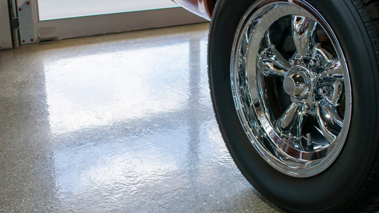 Epoxy coating on garage floor with car tire