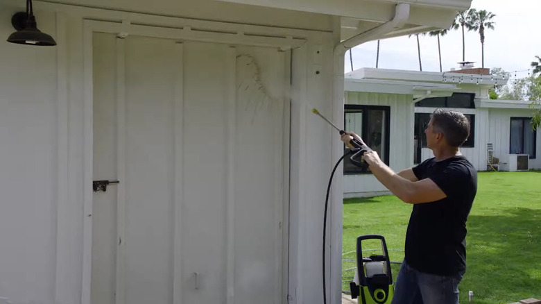 A person using Sun Joe's SPX3000 Electric Pressure Power Washer.