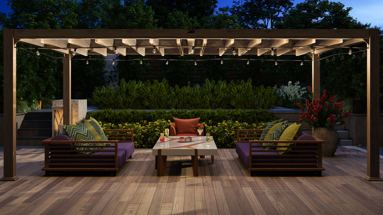A well-lit modern patio after dark