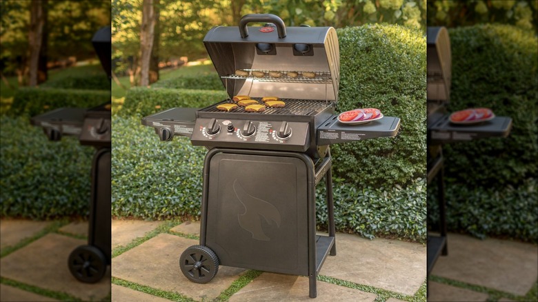 A Char-Griller grill cooking burger patties and sausages outside