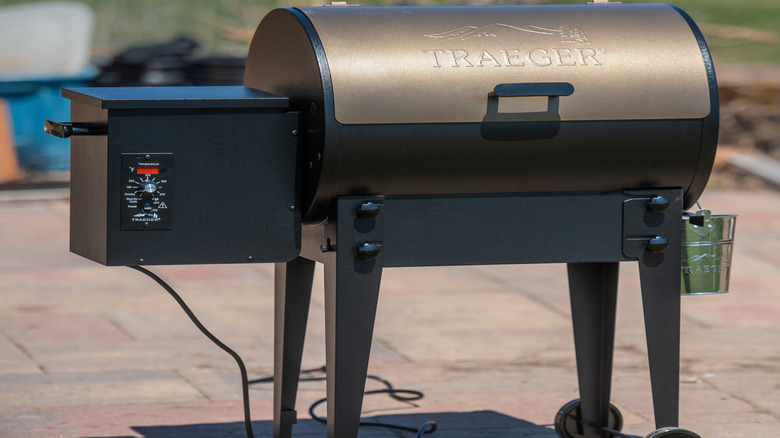 A clean Traeger pellet grill sitting outside