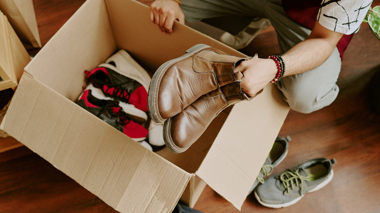 Taking shoes out of a box