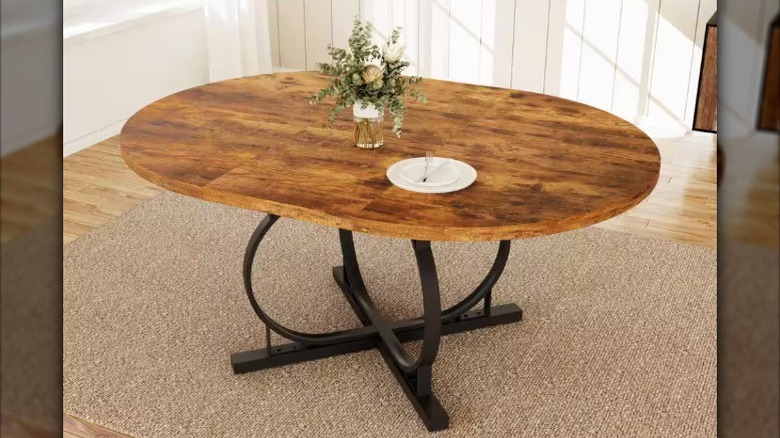 The 59-inch Modern Vintage Brown Dining Table from Home Depot in a dining room setting