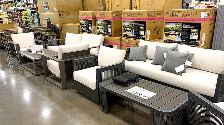 A look at patio furniture sets on display and in boxes at a Costco warehouse
