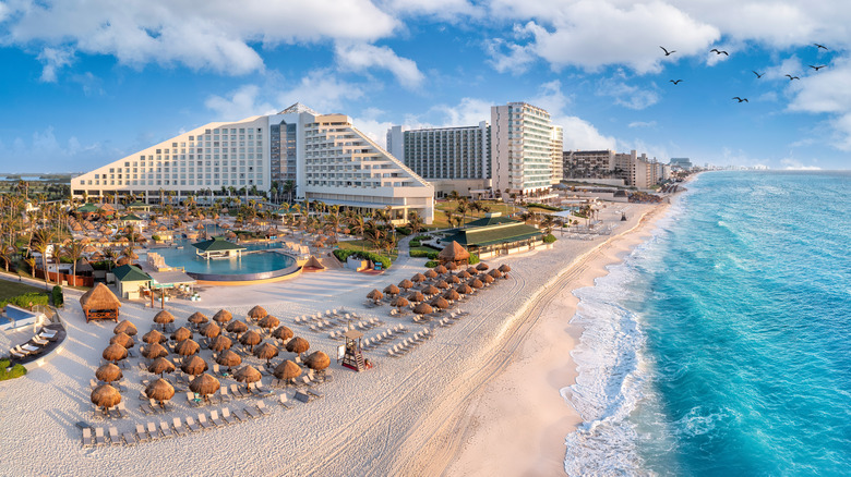 cancun beach with resorts near ocean