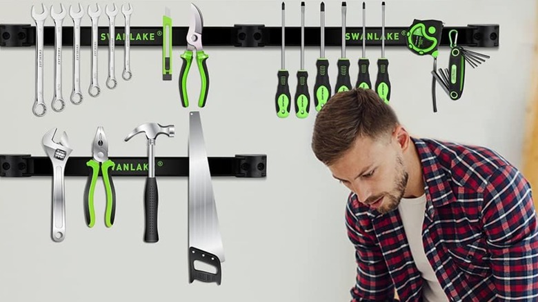 A man in a checked shirt working in front of the RamPro magnetic tool holder
