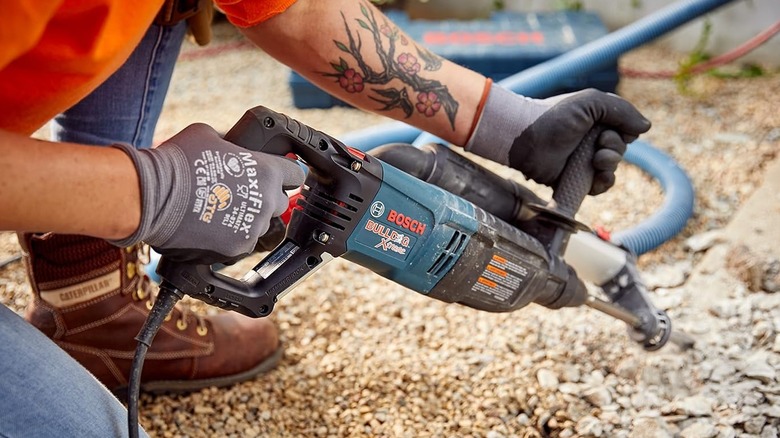 The Bosch rotary hammer breaking up concrete in the yard
