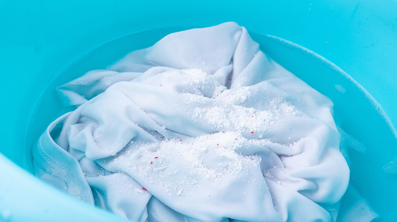 White clothes soaking in a blue bowl