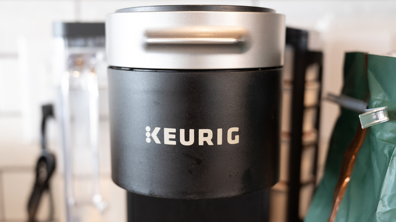 Close up image of a black and silver Keurig coffee machine