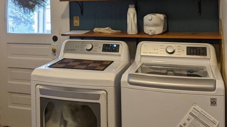 LG top loading washing machine and dryer in a laundry room