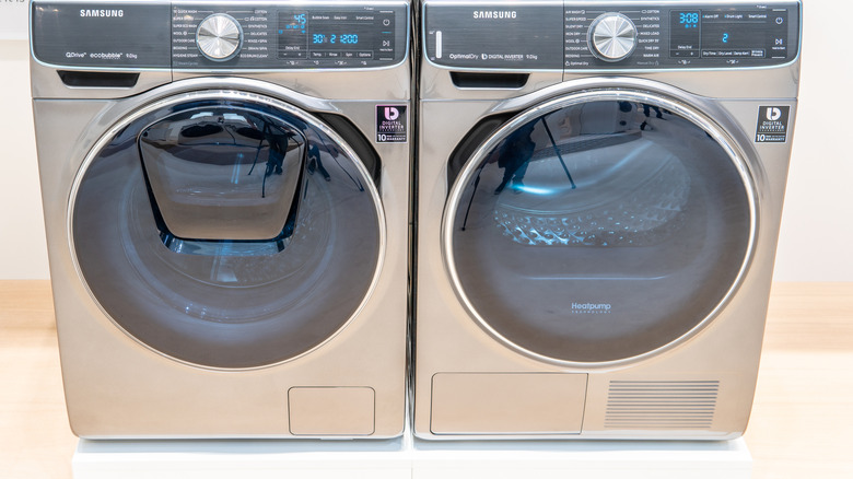Stainless steel Samsung washing machine and dryer side-by-side