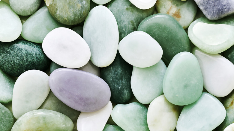 Close-up of Polished Tumbled Jade Pebbles in Green and Lavender Purple Hues