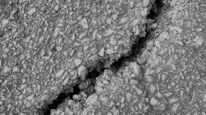 Close up of cracks in driveway