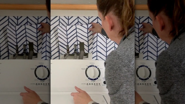 DIYer hides her washing machine hook up with a seamless DIY.