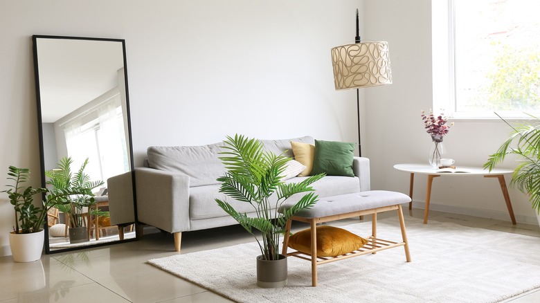 Living room with sofa and mirror