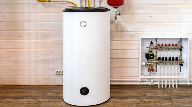 A boiler tank for heating sits in a room