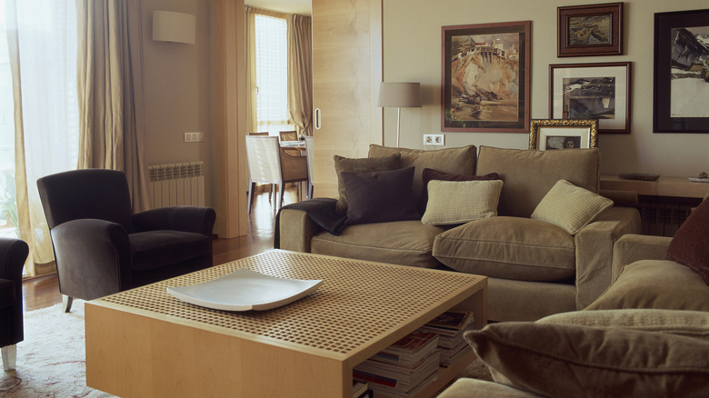 cozy living setup with comfortable sofas, lots of seating, and a large storage coffee table