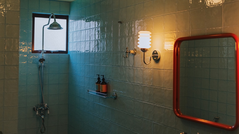 A bathroom covered in blue handmade tiles.