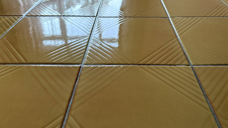 Glossy yellow floor tiles.