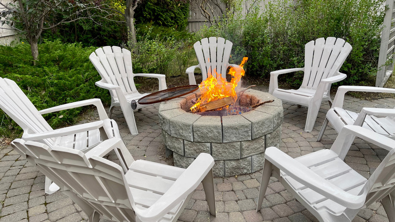 A patio space dominated by an immovable stone-built firepit