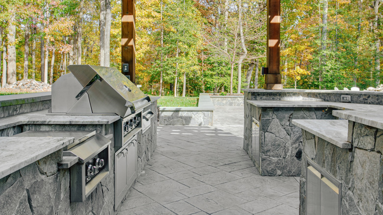 A large outdoor kitchen with various appliances