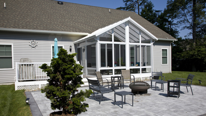 A backyard with a large concrete patio