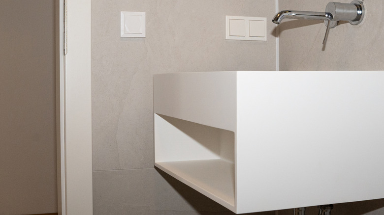 A modern floating vanity and sink.