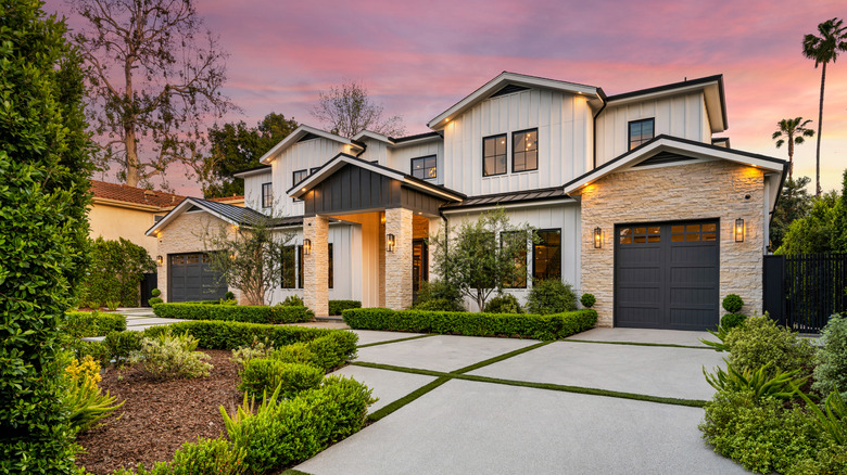 view of home from curb during sunset