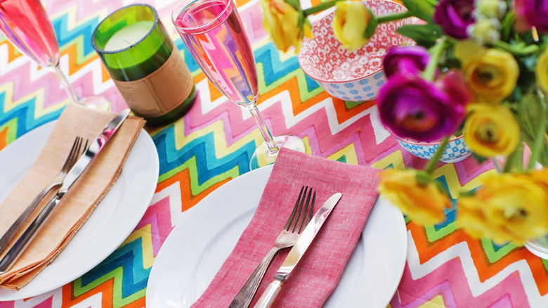 Multicolored patterned tablecloth on table setting