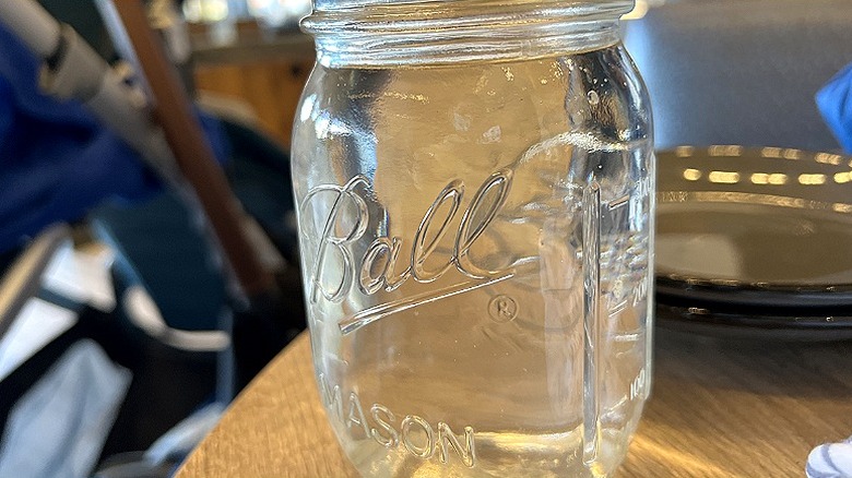 Close-up of a clear empty Ball mason jars on a table