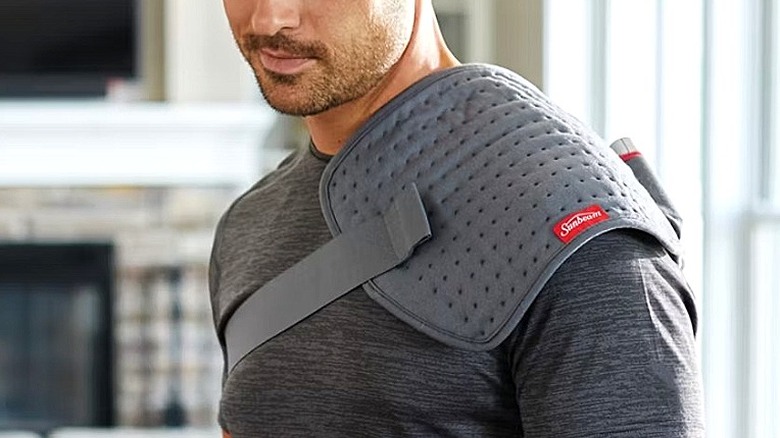 Close-up of a person's shoulder covered with a pain-relief pad