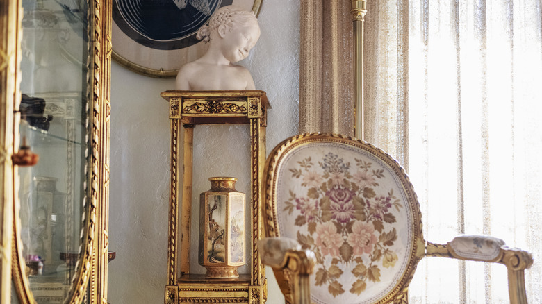 Old fashioned living room with gilded furniture